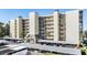 Condo building with covered parking and lush landscaping at 3200 Cove Cay Dr # 1E, Clearwater, FL 33760