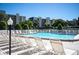 Refreshing community pool with ample lounge chairs at 3200 Cove Cay Dr # 1E, Clearwater, FL 33760