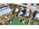 Aerial view of a home situated on a canal with docks and boats at 333 Bay Plz, Treasure Island, FL 33706