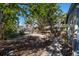 Backyard path leading to a private dock and waterway access at 333 Bay Plz, Treasure Island, FL 33706
