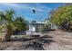 Backyard of a light blue home with a small concrete patio at 333 Bay Plz, Treasure Island, FL 33706