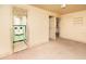 Empty bedroom with doorway to a green-tiled bathroom at 333 Bay Plz, Treasure Island, FL 33706