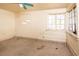 Empty bedroom with ceiling fan and multiple windows at 333 Bay Plz, Treasure Island, FL 33706