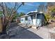 Exterior view of a small, light blue, single-story home with a covered entrance at 333 Bay Plz, Treasure Island, FL 33706