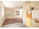 Empty kitchen with white walls and tiled flooring, ready for renovation at 333 Bay Plz, Treasure Island, FL 33706