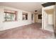 Spacious living area with large windows and pink flooring at 333 Bay Plz, Treasure Island, FL 33706
