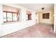 Large living room with multiple windows and pink flooring at 333 Bay Plz, Treasure Island, FL 33706