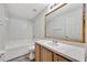 Bathroom with wood vanity and a large mirror at 3870 Island Way, St Petersburg, FL 33705