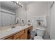 Clean bathroom with a vanity, toilet, and shower at 4508 Barnstead Dr, Riverview, FL 33578