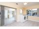 Laundry area with washer, dryer, and access to the kitchen and backyard at 4987 Jonquil N Pl, Pinellas Park, FL 33782