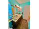 Clean bathroom with a vanity, toilet, and wood-look flooring at 546 Chevy Chase Dr, Sarasota, FL 34243