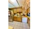 Kitchen with wood cabinets and dishwasher at 546 Chevy Chase Dr, Sarasota, FL 34243