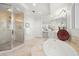 Bright bathroom featuring a walk-in shower and soaking tub at 555 5Th Ne Ave # 621, St Petersburg, FL 33701