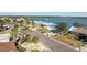 Aerial view of street with houses and palm trees at 568 Johns Pass Ave, Madeira Beach, FL 33708