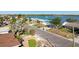 Aerial view of street with houses and palm trees at 568 Johns Pass Ave, Madeira Beach, FL 33708