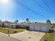Single-story home with three-car garage and waterfront view at 568 Johns Pass Ave, Madeira Beach, FL 33708