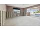 Large bedroom with patio doors and exposed framing at 568 Johns Pass Ave, Madeira Beach, FL 33708