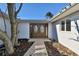 House entrance with double wooden doors at 568 Johns Pass Ave, Madeira Beach, FL 33708