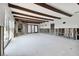Spacious living area with exposed beams and water damage. Needs renovation at 568 Johns Pass Ave, Madeira Beach, FL 33708
