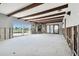 Living room with water damage and exposed beams. View of water access at 568 Johns Pass Ave, Madeira Beach, FL 33708