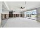 Spacious living room with water damage, currently undergoing renovations at 568 Johns Pass Ave, Madeira Beach, FL 33708