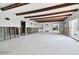 Living room with exposed beams and significant water damage, needs renovation at 568 Johns Pass Ave, Madeira Beach, FL 33708