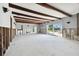 Large living room with exposed beams and significant water damage at 568 Johns Pass Ave, Madeira Beach, FL 33708