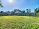 Expansive backyard with lush green lawn and full fence, ideal for outdoor enjoyment at 6724 4Th N Ave, St Petersburg, FL 33710