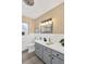 Bathroom with gray vanity, white tile, and modern fixtures at 9229 Overlook Dr, Temple Terrace, FL 33617