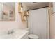 Pink bathroom with unique wooden storage shelves and white shower curtain at 9830 Mark Twain Ln, Port Richey, FL 34668