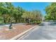Landscaped park entrance with charming statue and signage at 102 Shore E Dr, Oldsmar, FL 34677