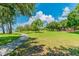Peaceful walking path winds through a waterfront park at 102 Shore E Dr, Oldsmar, FL 34677