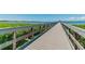 Wooden pier offering scenic waterfront views and relaxation at 102 Shore E Dr, Oldsmar, FL 34677
