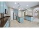 Eat-in kitchen with stainless steel appliances and light blue cabinetry at 10637 Liberty Bell Dr, Tampa, FL 33647