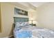 Bedroom with a queen-sized bed, coastal decor, and a serene ambiance at 12000 Gulf Blvd # 212-N, Treasure Island, FL 33706