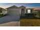 One-story home with a two-car garage and landscaped yard at 12338 Dora Trl, Parrish, FL 34219