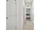 Bright hallway with tile floors and access to bedrooms at 12338 Dora Trl, Parrish, FL 34219