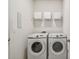 Bright laundry room with Samsung washer and dryer at 12338 Dora Trl, Parrish, FL 34219