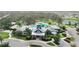 Community center with pool, palm trees, and parking at 13403 Orca Sound Dr, Riverview, FL 33579