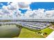 Stunning aerial view of a marina and waterfront community at 140 Riviera Dunes Way # 1001, Palmetto, FL 34221