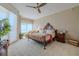 Main bedroom with a king-size bed and plenty of natural light at 140 Riviera Dunes Way # 1001, Palmetto, FL 34221