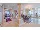 Bright dining room featuring a chandelier and hardwood floors at 140 Riviera Dunes Way # 1001, Palmetto, FL 34221