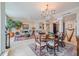 Open concept dining room with living room and hardwood floors at 140 Riviera Dunes Way # 1001, Palmetto, FL 34221