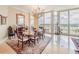 Spacious dining room with water views and hardwood floors at 140 Riviera Dunes Way # 1001, Palmetto, FL 34221