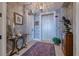 Elegant entryway with elevator access and decorative wallpaper at 140 Riviera Dunes Way # 1001, Palmetto, FL 34221