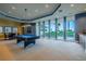 Well-lit game room featuring a billiard table and comfortable seating at 140 Riviera Dunes Way # 1001, Palmetto, FL 34221