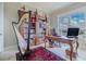 Bright home office featuring built-in bookcase and hardwood desk at 140 Riviera Dunes Way # 1001, Palmetto, FL 34221
