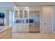 Modern kitchen with stainless steel appliances and custom cabinetry at 140 Riviera Dunes Way # 1001, Palmetto, FL 34221