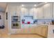 Elegant kitchen with stainless steel appliances and white cabinetry at 140 Riviera Dunes Way # 1001, Palmetto, FL 34221