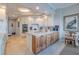 Modern kitchen with granite countertops and custom cabinetry at 140 Riviera Dunes Way # 1001, Palmetto, FL 34221